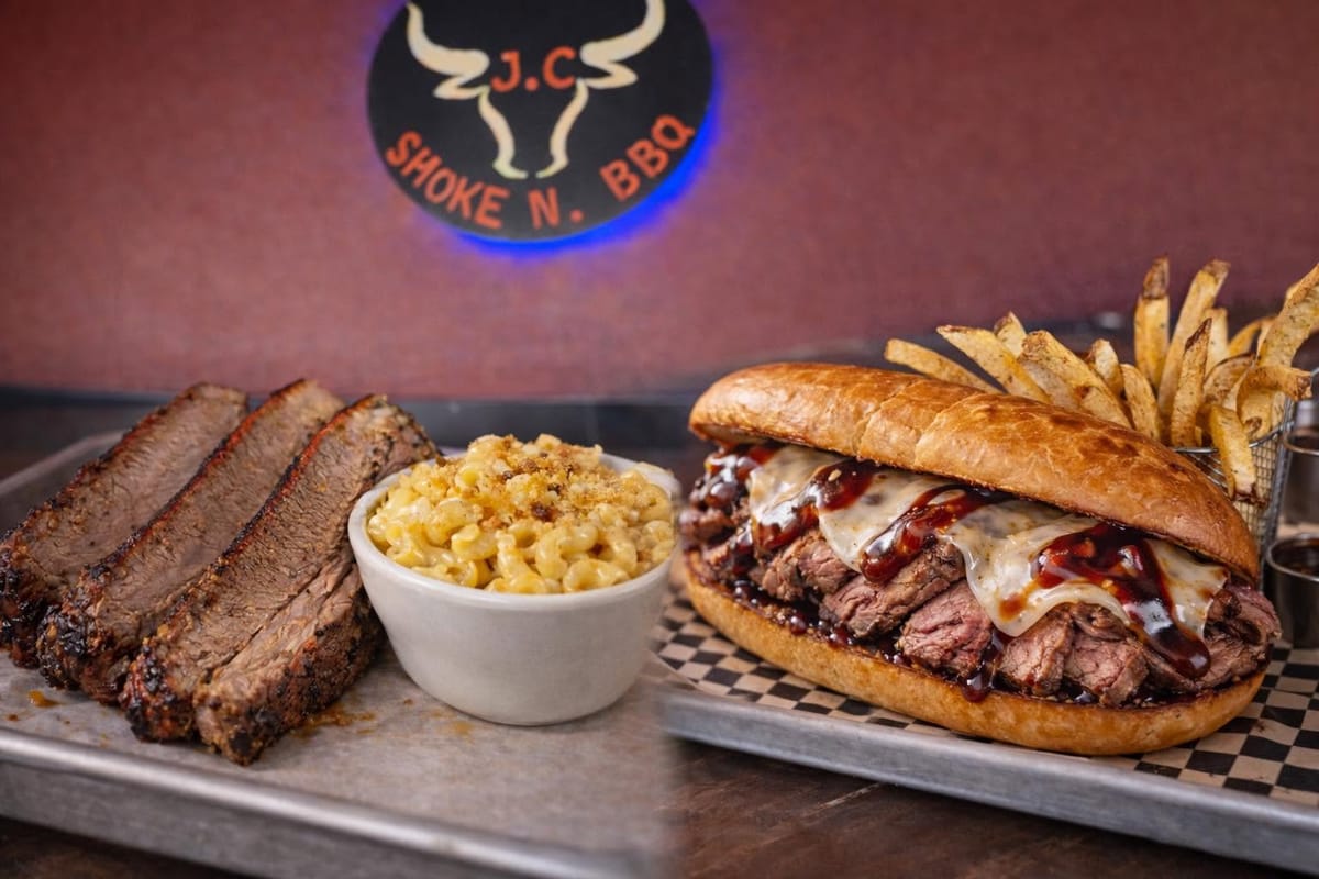 Sliced brisket with mac and cheese beside a tri tip sandwich with fries